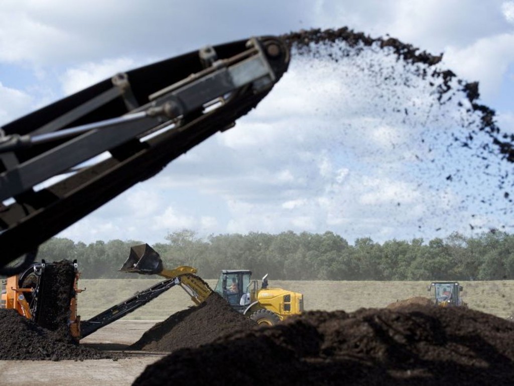 Machine spewing biosolids